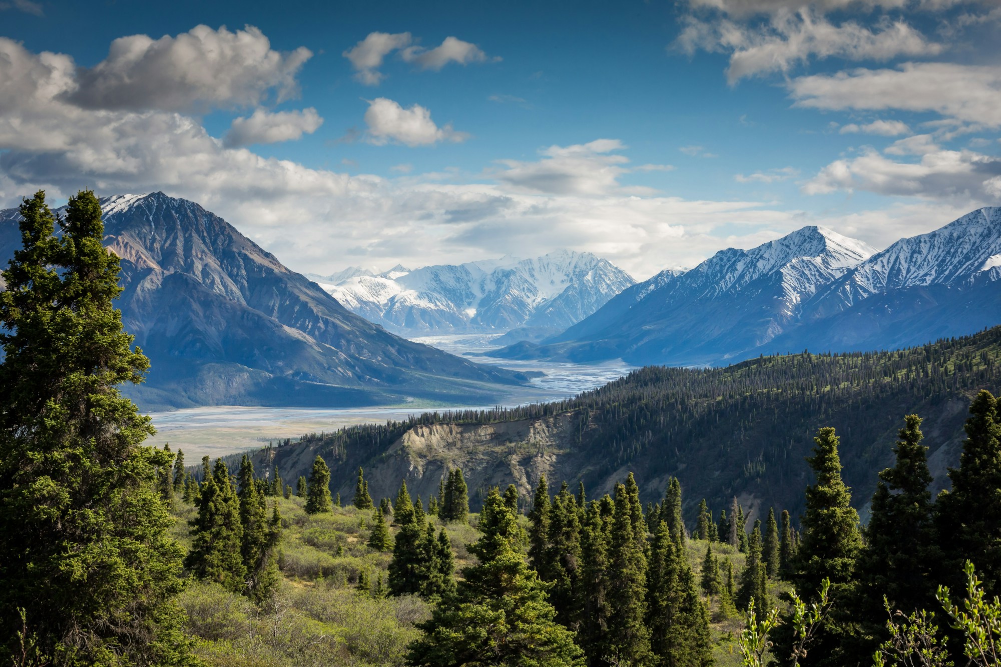 Dramatic alpine peaks with layered ridges fading into the distance