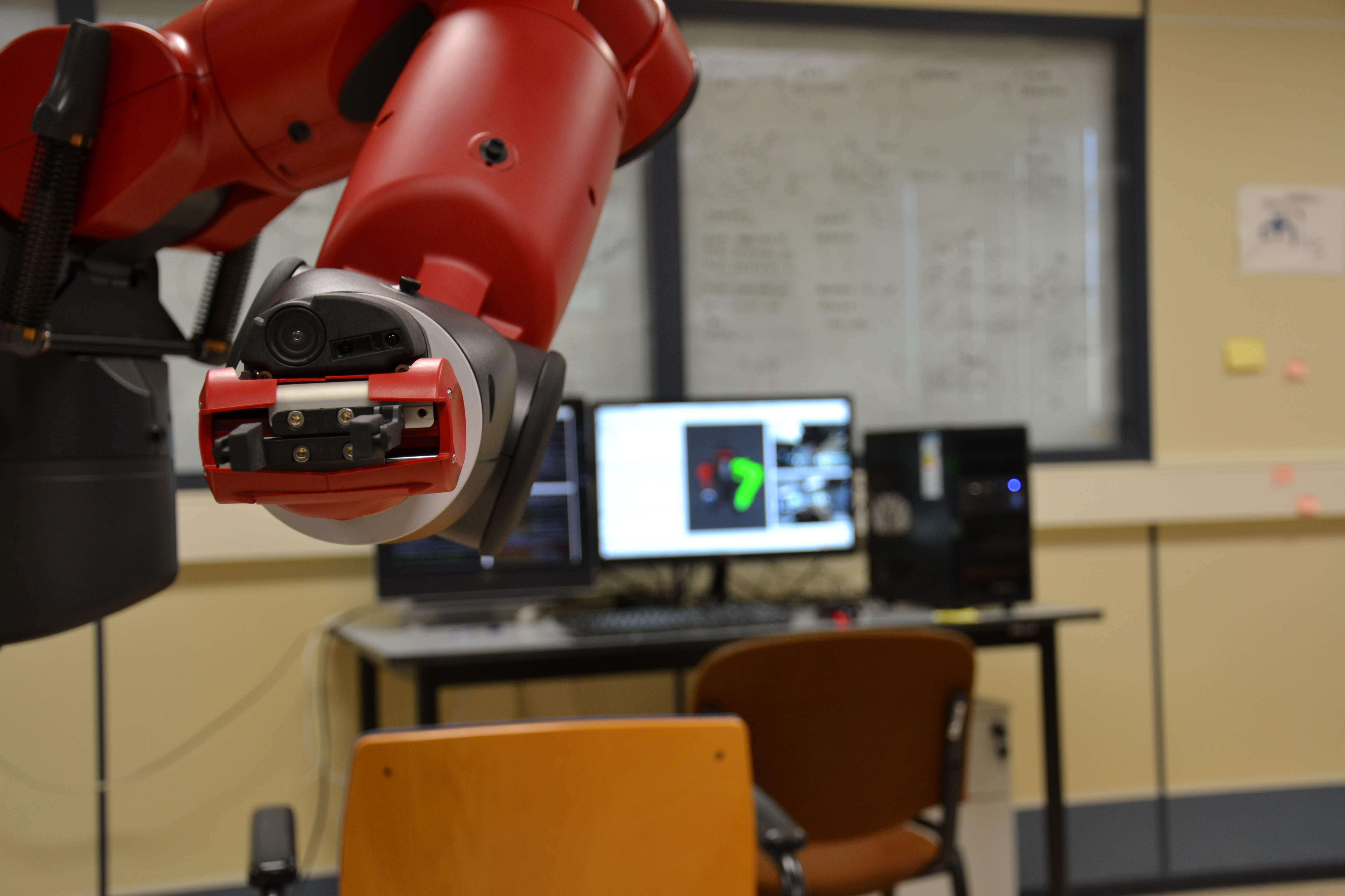 Close-up photograph of a Baxter robot’s gripper and wrist camera